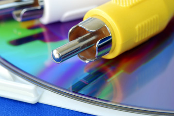Close-up view of the RCA video cable on a CD isolated on blue