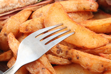 Potato wedges and fork
