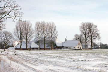 Farm in a white winter landscape