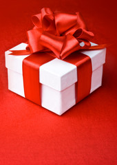 White box on a red background with a red ribbon