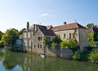 Naklejka na ściany i meble Old house on the river in France