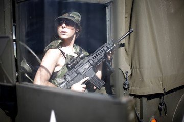 Fototapeta na wymiar Military woman with rifle