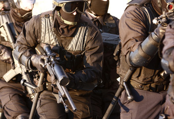 SWAT officers in full tactical gear - obrazy, fototapety, plakaty