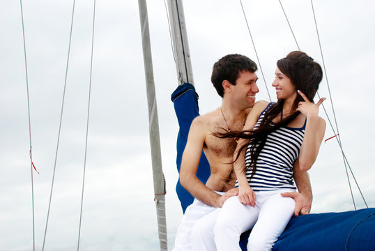Young couple onboard the yacht during a vacation