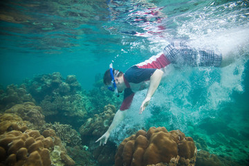 Snorkeling guy under the water