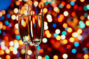Glasses with champagne on an abstract background