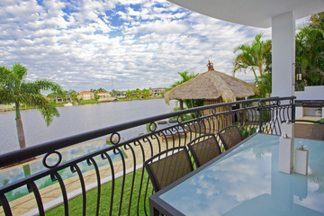 Balcony entertainment area of waterfront house