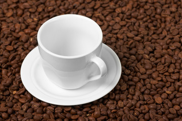 Fototapeta premium Cup , costing on coffee grain