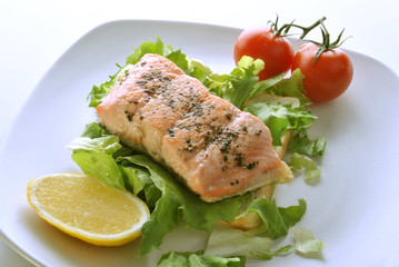 organic wild salmon fillet with salad and tomato