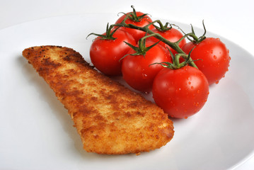 deep fried fish and some organic tomatoes