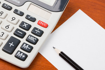 calculator,pencil and blank notepaper