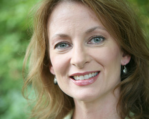 Fototapeta premium Head shot of a middle aged woman in an outdoor setting
