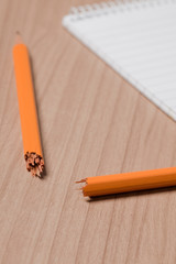 broken pencil and notepad