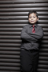 Young boy with arms crossed