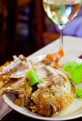 Fried fish on grill  in salt