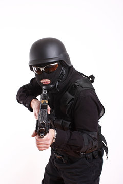 SWAT police officer with assault gun.