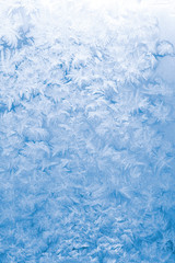 Fototapeta premium Light blue frozen window glass