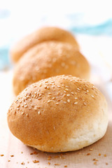 Three wheat buns with sesame