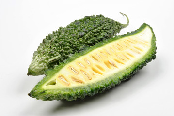 fresh organic karela and a white background