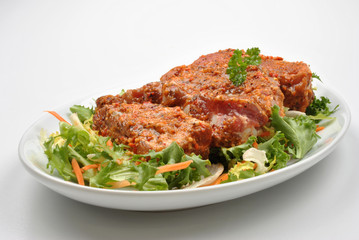 some marinated organic rib on healthy salad