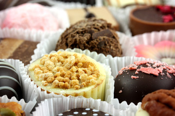 Luxury individual chocolates in cases closeup