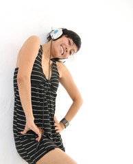 smiling and wearing headphones