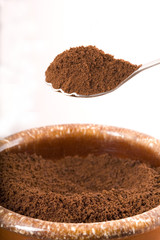 Spoonful of coffee grounds.