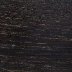 Black wooden pattern veneer closeup.