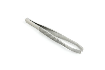 Steel tweezers on the white
