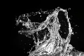 Schilderijen op glas Stylish water splash. Isolated on black background © Nejron Photo
