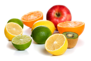 Lemon and other fruit isolated on white