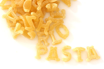 Pasta noodles in alphabet shapes forming word pasta