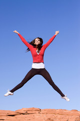 Young athletic woman jumping