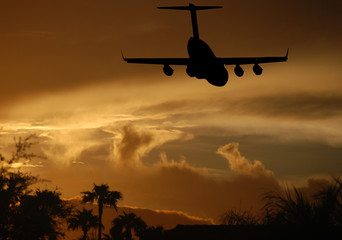 Jet landing at sunset