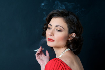 Obraz premium Beautiful Model in red smoking