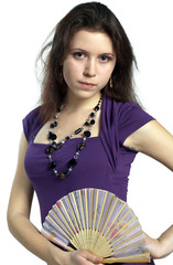 Beautiful russian girl in dress with fan
