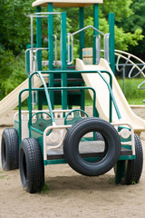 Playground equipment with car and tires