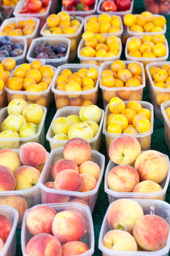 baskets of peaches and plums