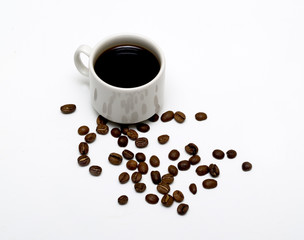 white coffee cup and coffee beans