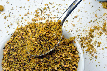 some organic lemon pepper in a white bowl