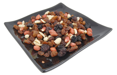 mixed dry fruit on plate isolated on white background