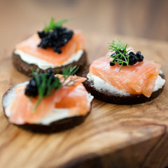 Canapes with salmon and caviar