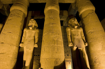 Statues of Ramses II at Luxor temple at night
