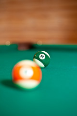 Billiard balls on green table