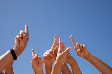 hands raised to the sky