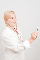 Young pretty female doctor with stethoscope