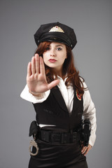 young and sexy officer gesturing to stop