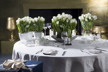 Decoration of dining table for Valentine's Day. White tulip.