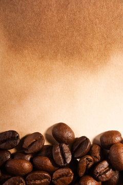 coffee beans on old paper © Kirill Polovnoy