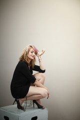 Naklejka premium Pretty woman in a black dress.
